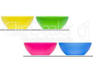 Coloured bowls on shelves
