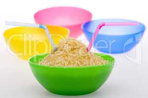 Rice and straw in green bowl in fro