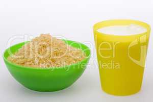 Rice in green bowl and milk in yell