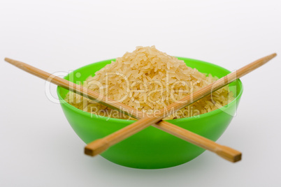 Rice and chopsticks in green bowl