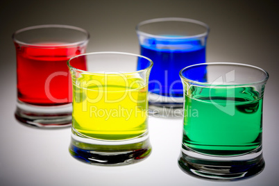 Coloured drinks in shot glass