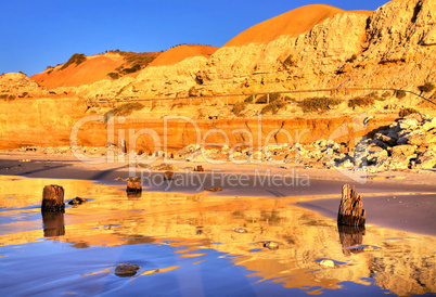 Golden Cliff Reflections