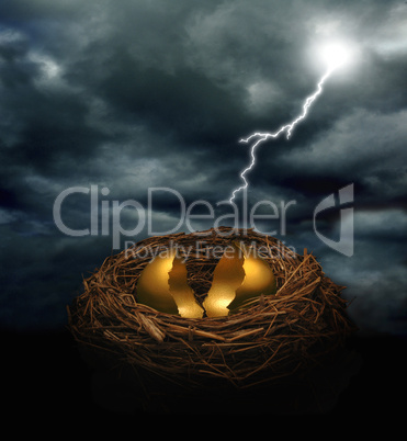 A cracked golden nest egg under a d
