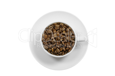 Ceramic cup and saucer filled with coffee beans