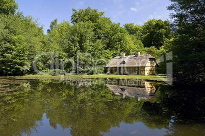 Old house at the forest lake