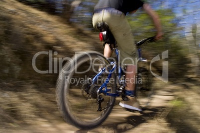 Riding a mountain bike through the