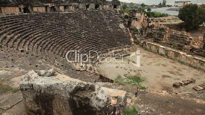 Tourist man visiting ancient  amphitheater