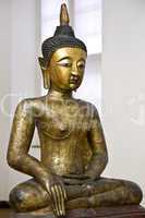 Buddha statue in earth touching ges