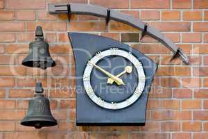 Modern wall clock and two bells