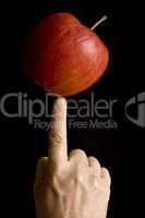 Balancing an apple at the fingertip