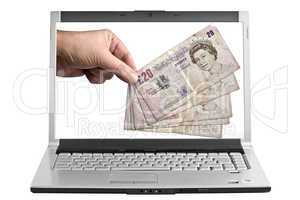 Five twenty Pound notes on the Compter