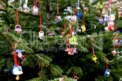 Baby dummies hung up in the christmastree