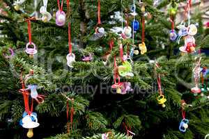 Baby dummies hung up in the christmastree
