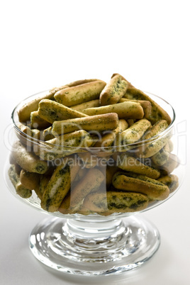 Glass of Grissini snacks with garli