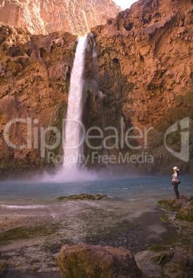 HIKER AT MOONEY FALLS VERTICLE