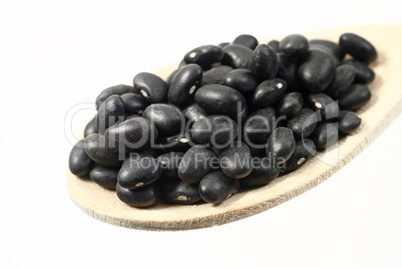 Beans in a wooden spoon