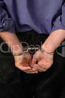 Arrested prisoner's hands in handcu