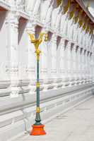 Lamp post and detail of temple building at Wat Mahatat in Bangkok, Thailand.