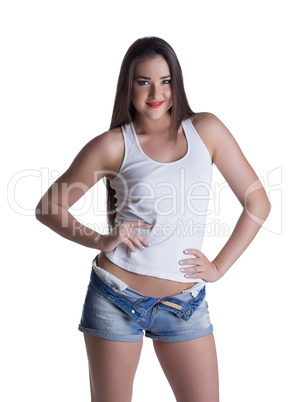 Young brunette woman in denim shorts and white top