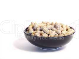Black bowl with unshelled peanuts