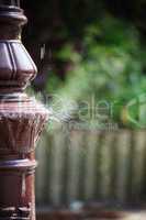 Water splashing on a lamppost