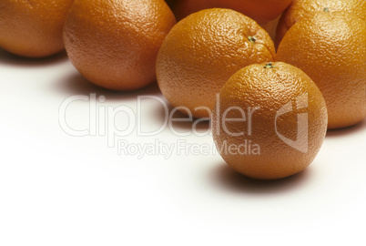 Oranges on a white surface