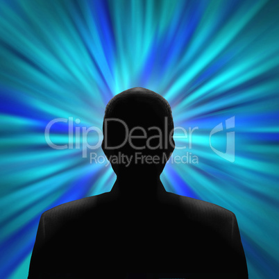 Silhouetted man in front of a blue