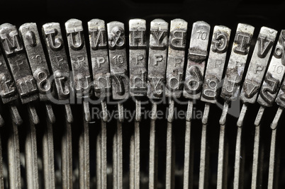 Close-up of old typewriter letter and symbol keys