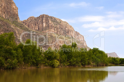 Mexican Sierra Ponce cliffs over looking the Rio Grande border with the United States at the Santa Elena Canyon River access area of Big Bend National Park, Texas
