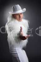 Sexy young dancer in white fur costume