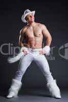 Muscular dancer in white cowboy costume