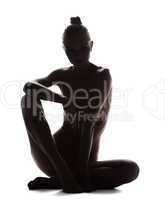 Silhouette of nude young woman