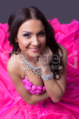 Beautiful young dancer in pink costume