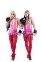 Two transvestites in pink costumes isolated