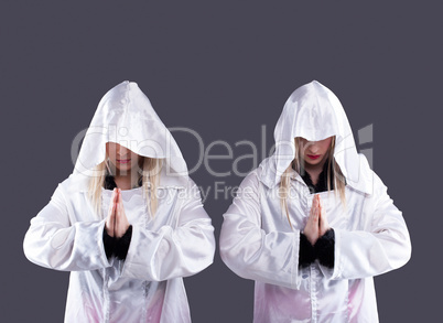 Two transvestites in white cloaks