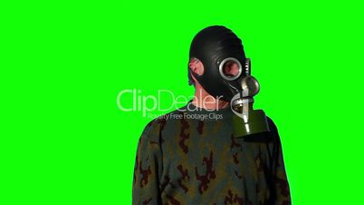 Man in gas mask on a green screen