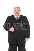 Elegant fat man in a black suit shows thumb-up