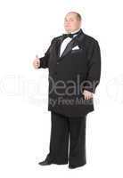 Elegant fat man in a tuxedo shows thumb-up