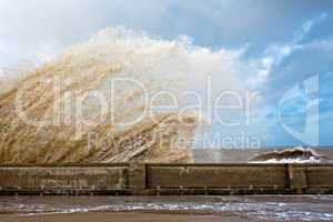 Huge waves crashing onto promenade