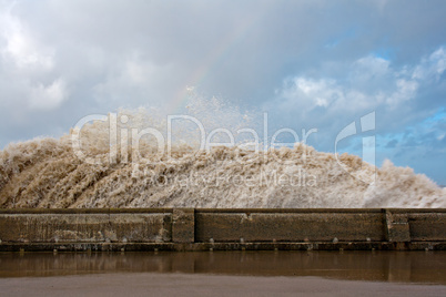 Huge waves crashing onto promenade
