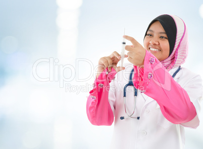Muslim doctor filling the syringe