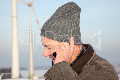 Man in winter when phoning