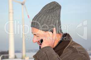 Man in winter when phoning