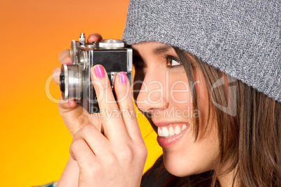Hip Woman Snaps a Picture with Vintage Camera