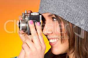 Hip Woman Snaps a Picture with Vintage Camera
