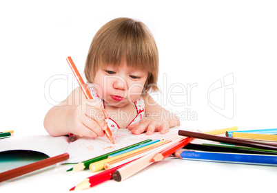Little baby girl draws pencil