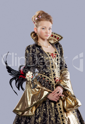 Teen age girl in carnival costume with mask