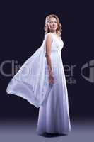 Young woman in beautiful long white dress