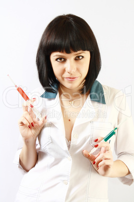 brunette in white robe with syringe