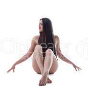 Young naked woman sit with beautiful long hair